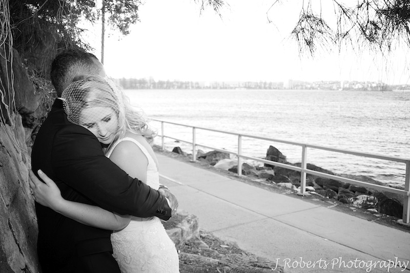 Groom hugging bride - wedding photography sydney